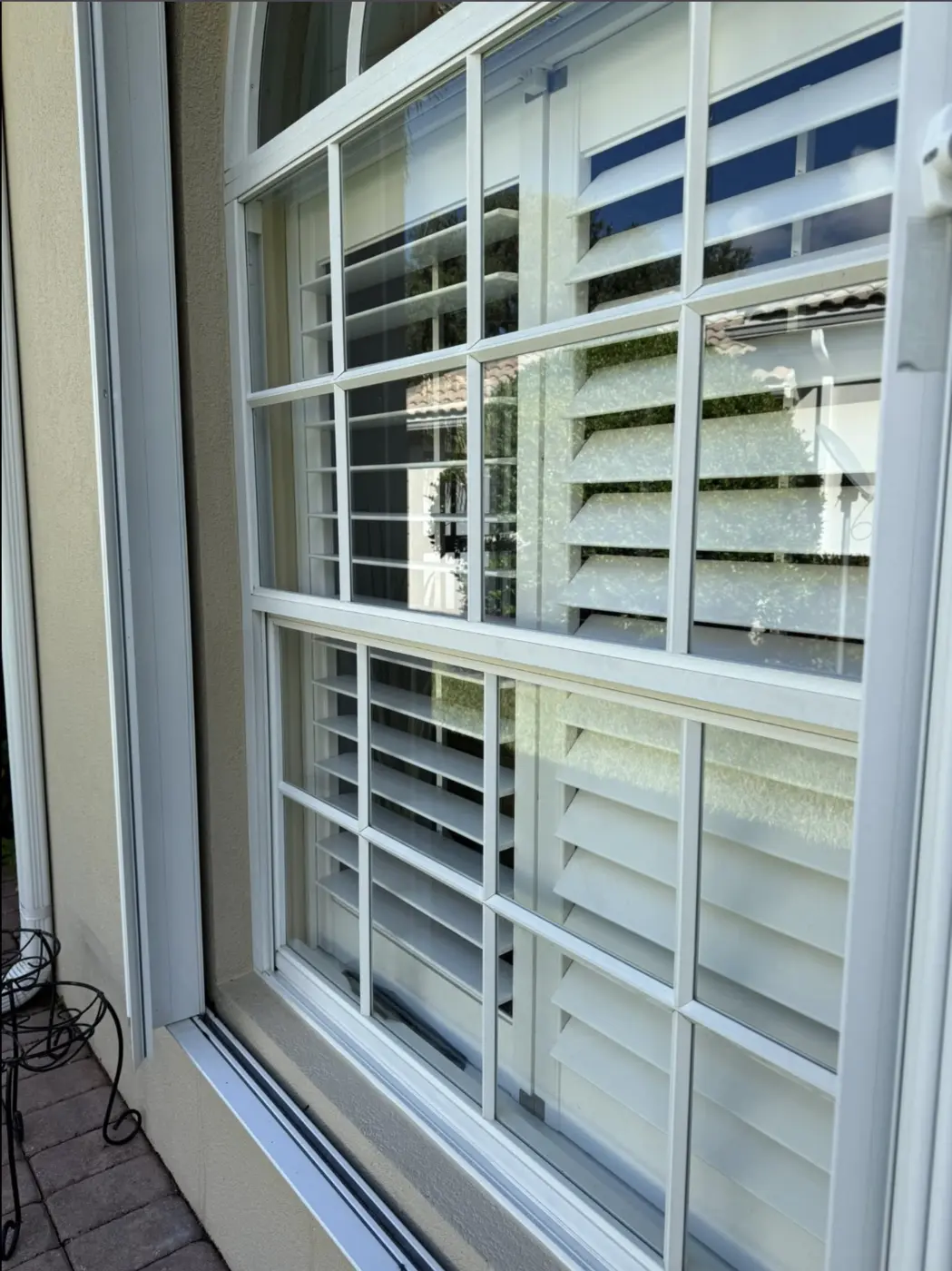 The same paned window, crisp and clear after professional cleaning