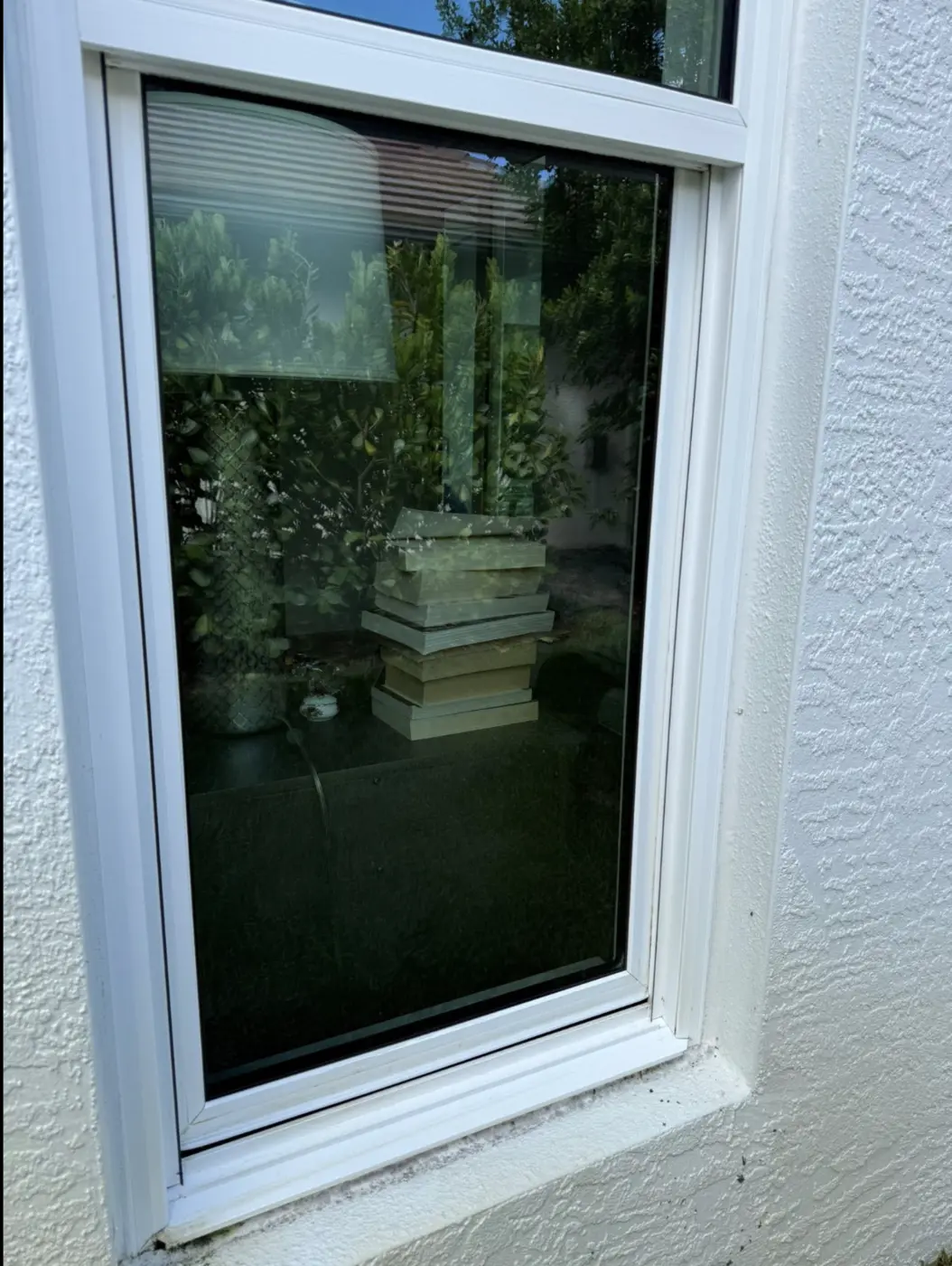 The same window with streak-free glass and a spotless sill after cleaning