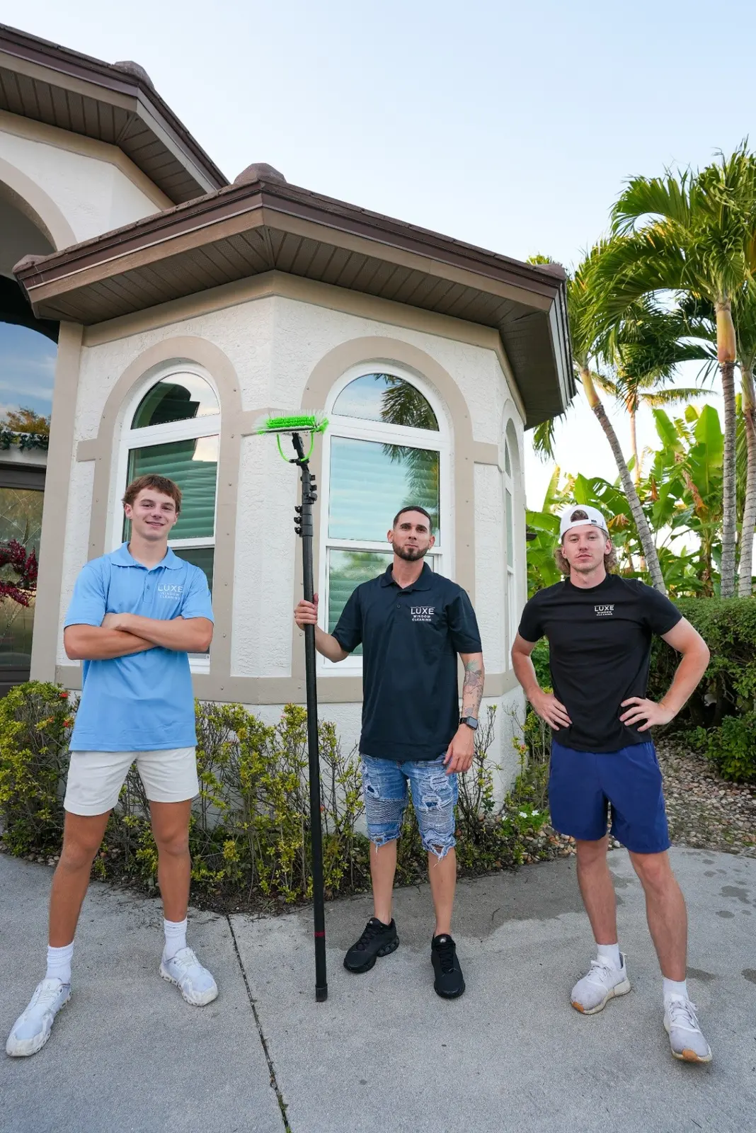 The For His Glory team posed with window cleaning equipment